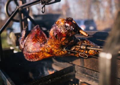 Cooking a pig at a catered event